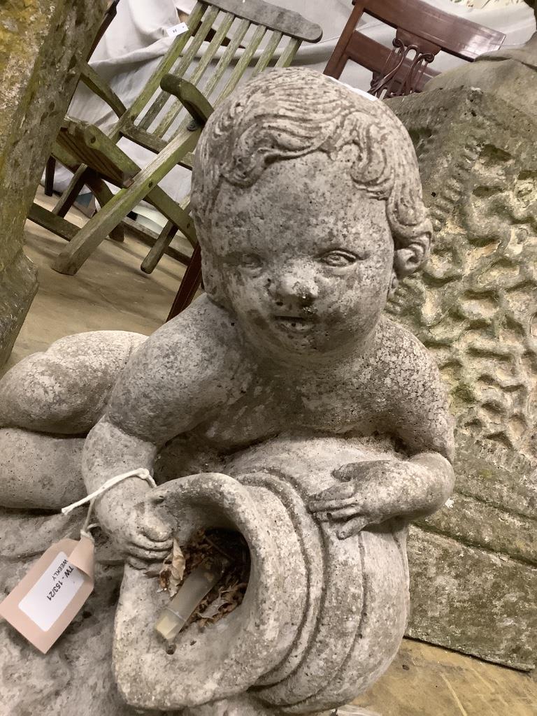 A reconstituted stone cherub fountain, height 40cm